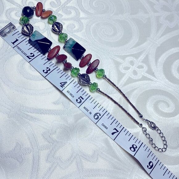 Asymmetrical bead necklace unique beads in green, blue, black, brown, & silver - Picture 7 of 7